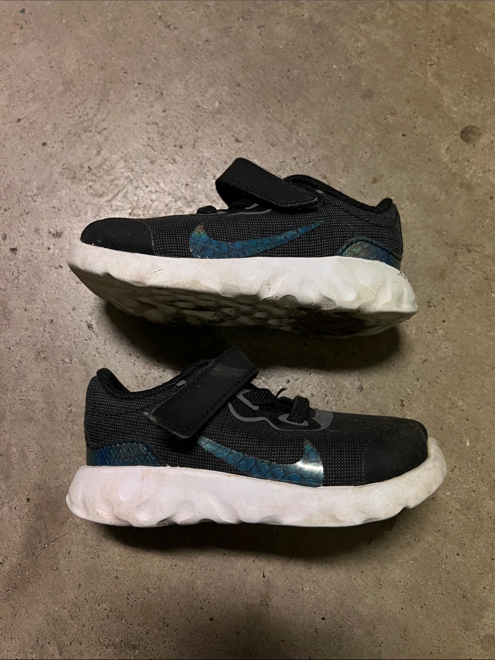 Nike Kids Black Sneakers with Blue Accent Swoosh